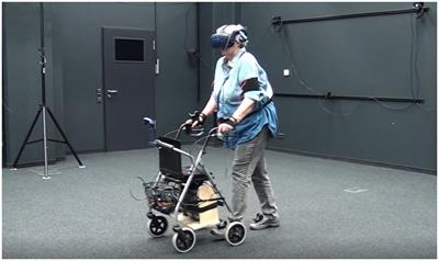Evaluation of an assistance system supporting older pedestrians’ road crossing in virtual reality and in a real-world field test
